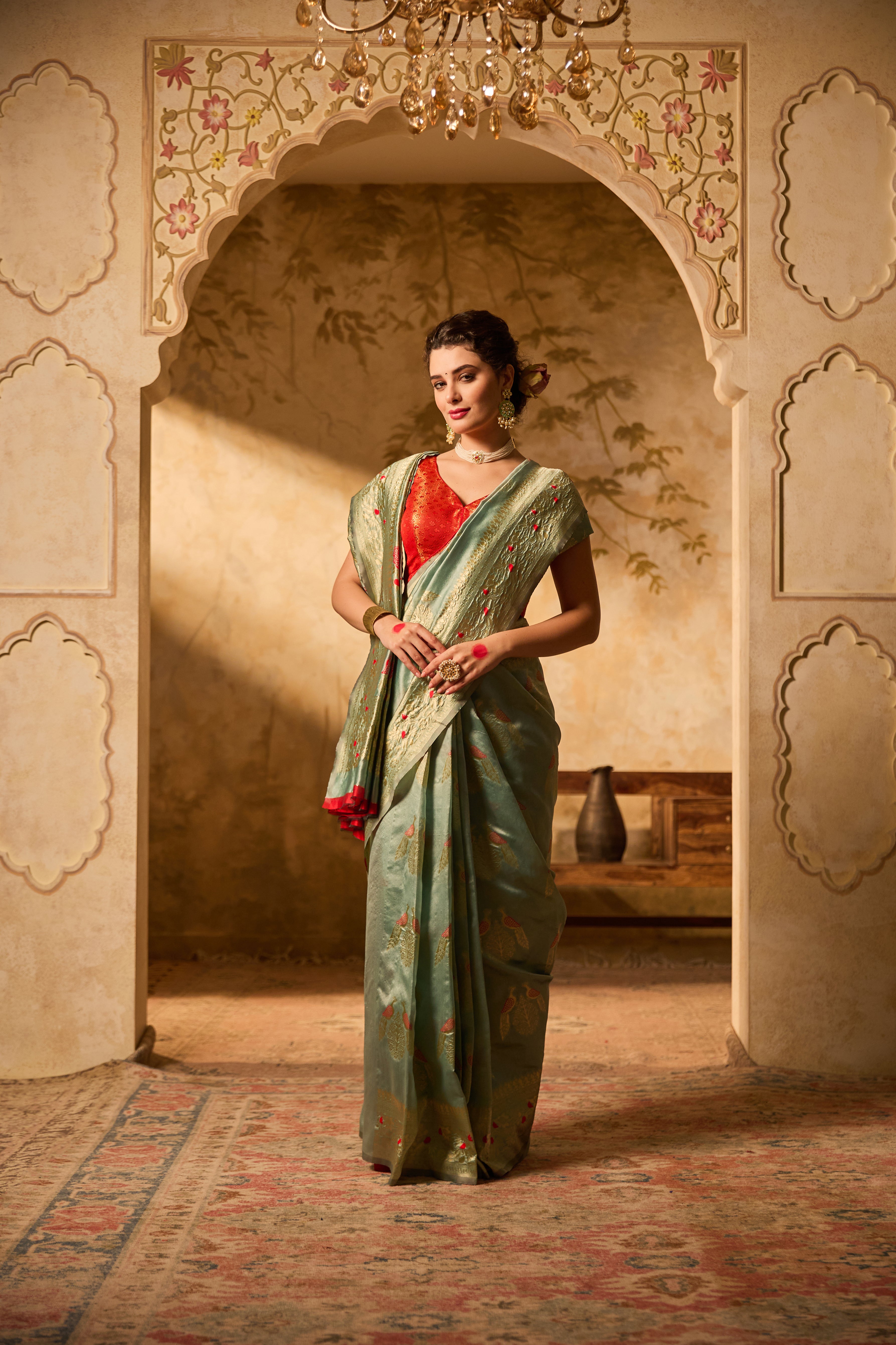 Sea Green Banarasi Silk Saree With Delicate Gold Zari Motifs & Floral Accents